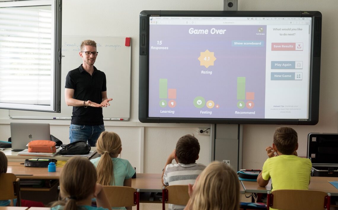 teacher with 5 students listening